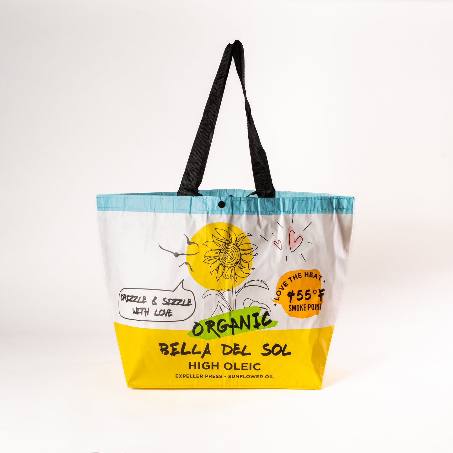 
                  
                    Bella Del Sol white reusable grocery bag with branded logo, shown in a standing position with reinforced handles and eco-friendly design.
                  
                