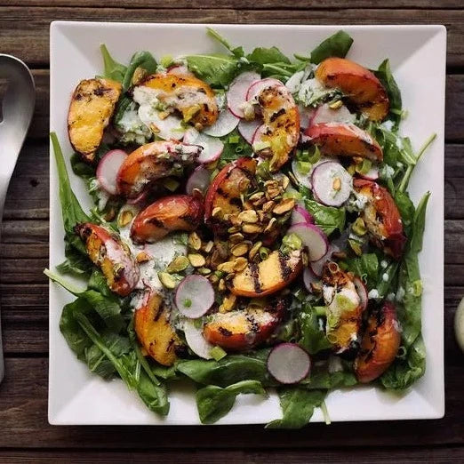 
                  
                    Grilled Peach Salad With Baby Arugula, Pistachios And Lemony Yogurt Dressing
                  
                