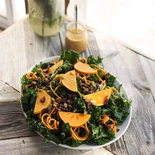 
                  
                    Massaged Kale Salad with Sweet Potato Noodles, Persimmon and a Smoky Orange Vinaigrette
                  
                